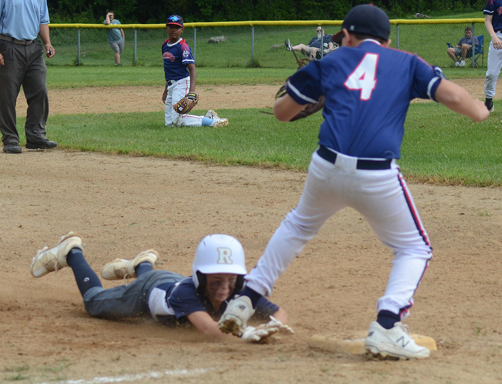 Pine Bush Rebels’ Cody Vanoyan dives into third base during Saturday’s New York Elite Baseball Around the Horn 12U tournament game at the Town of Newburgh Little League complex.